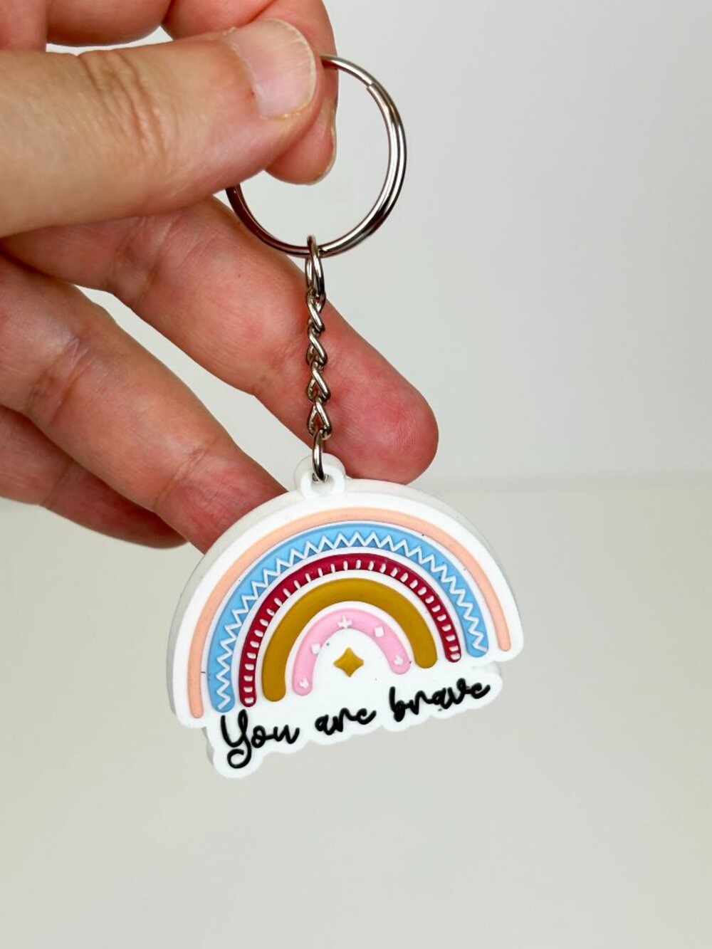 Cute Rainbow with motivational phrase You are brave Silicone keychain charm. New